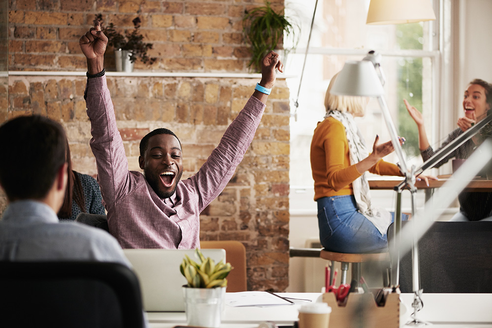 businessman-with-arms-raised-celebrating-success-w-2023-11-27-04-57-55-utc
